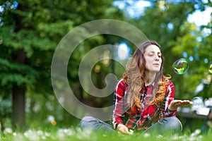 Beautiful young woman blowing bubble outdoor happy lifestyle