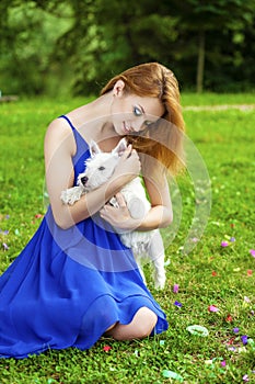 Beautiful young woman in blue dress