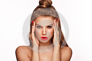 Beautiful young woman with bright makeup and neon pink nails. Beauty face. Photo taken in the studio