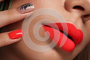 Beautiful young woman with bright makeup and neon pink nails. Beauty face. Photo taken in the studio