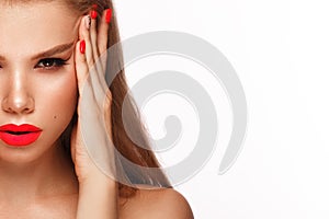 Beautiful young woman with bright makeup and neon pink nails. Beauty face. Photo taken in the studio