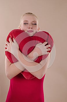 Beautiful young woman in a bright red slinky dress