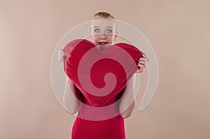 Beautiful young woman in a bright red slinky dress