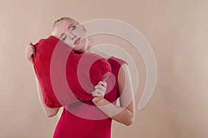 Beautiful young woman in a bright red slinky dress