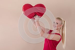 Beautiful young woman in a bright red slinky dress