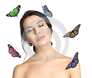 Beautiful young woman and butterflies on background