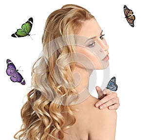 Beautiful young woman and butterflies on background