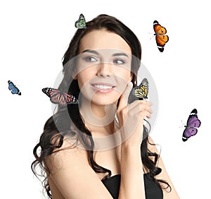 Beautiful young woman and butterflies on background