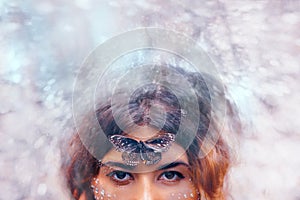 Beautiful young woman with butterfly. conceptual. double exposure