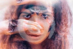 Beautiful young woman with butterfly. conceptual. double exposure