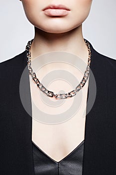 Beautiful young woman with chain necklace