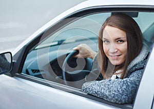 Young woman driving car in the city