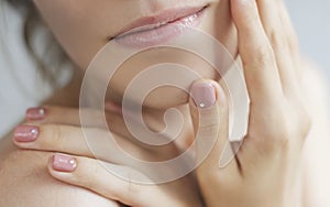 Beautiful Young Woman with Clean Fresh Skin. Close up Portrait.