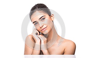 Beautiful Young Woman with Clean Fresh Skin touch own face