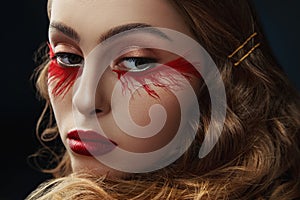 Beautiful young woman with clean perfect skin. Portrait of beauty model with bright red make up and long eyelashes