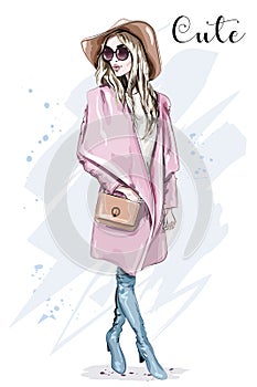 Beautiful young woman in coat and hat. Stylish clothing outfit. Fashion look. Sketch.