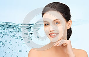 Beautiful young woman with collagen facial mask