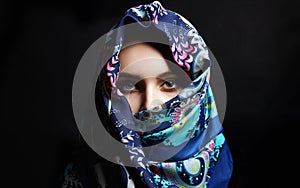 Beautiful young woman in color veil. beauty girl in colorful hijab photo