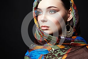 Beautiful young woman in color veil and jewelry. beauty girl in colorful hijab