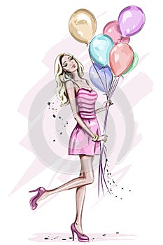 Beautiful young woman with colorful birthday balloons.