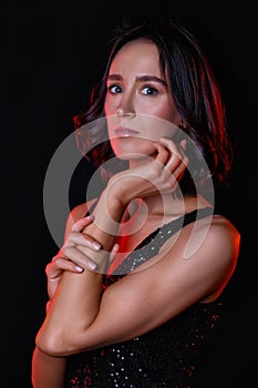 Beautiful young woman in colorful red and blue light. Art design, portrait of a girl in mixed neon light on a black background