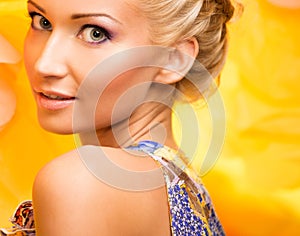 Beautiful young woman in colourful dress