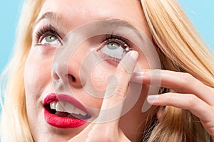 Beautiful young woman with contact lens