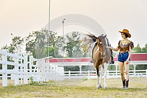 Beautiful young woman cowgirl. Asia girl