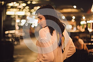 Beautiful young woman dancing alone in the bar at night party.