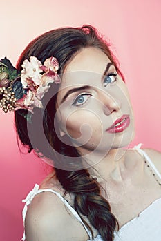 Beautiful young woman with delicate flowers in their hair