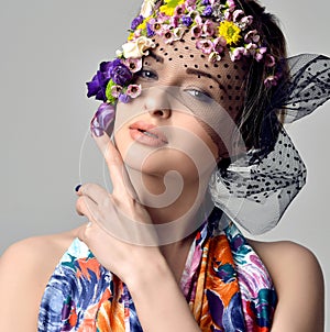 Beautiful young woman with delicate flowers in their hair