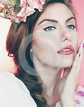 Beautiful young woman with delicate flowers in their hair