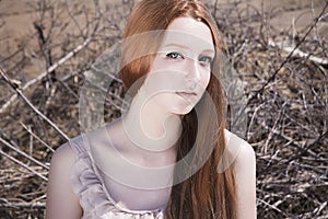 Beautiful young woman in desert