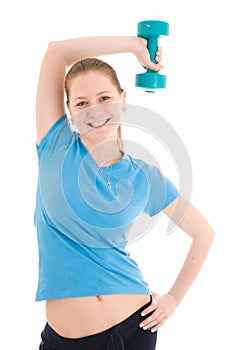 The beautiful young woman doing exercise isolated