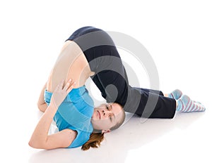 The beautiful young woman doing exercise isolated