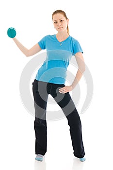 The beautiful young woman doing exercise isolated