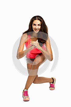 Beautiful young woman doing physical exercises, emotinal vertical portrait photo