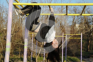 Beautiful young woman doing sports outdoors. Fitness concept.