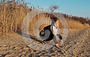 Beautiful young woman doing sports outdoors. Fitness concept.