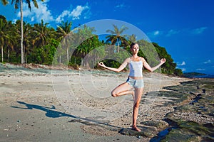 Beautiful young woman doing yoga exercise