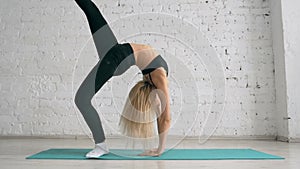 Beautiful Young Woman Doing Yoga Exercise, Stretching, Standing In Bridge Pose