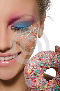 Beautiful young woman with donut