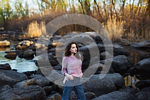 Beautiful young woman. Dramatic outdoor portrait of sensual brunette female with long hair. Sad and serious girl.