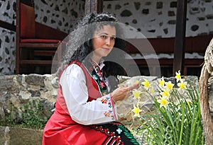 Beautiful young woman dressed in a traditional folklore costume