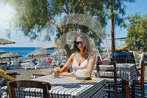 Beautiful young woman  drinking a coffee cocktail