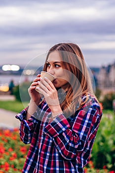 Beautiful young woman drinking coffee