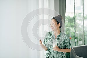 Beautiful young woman drinking milk