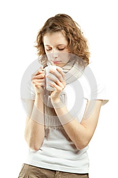 Beautiful young woman drinking tea/coffee