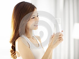 beautiful young woman drinking water