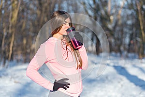 Beautiful young woman drinks tea